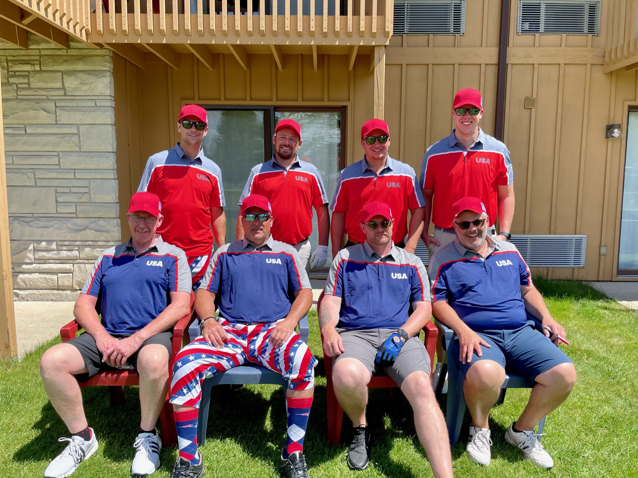 Team Jake posing outside the villa in coordinated USA uniforms before the Ryder Cup